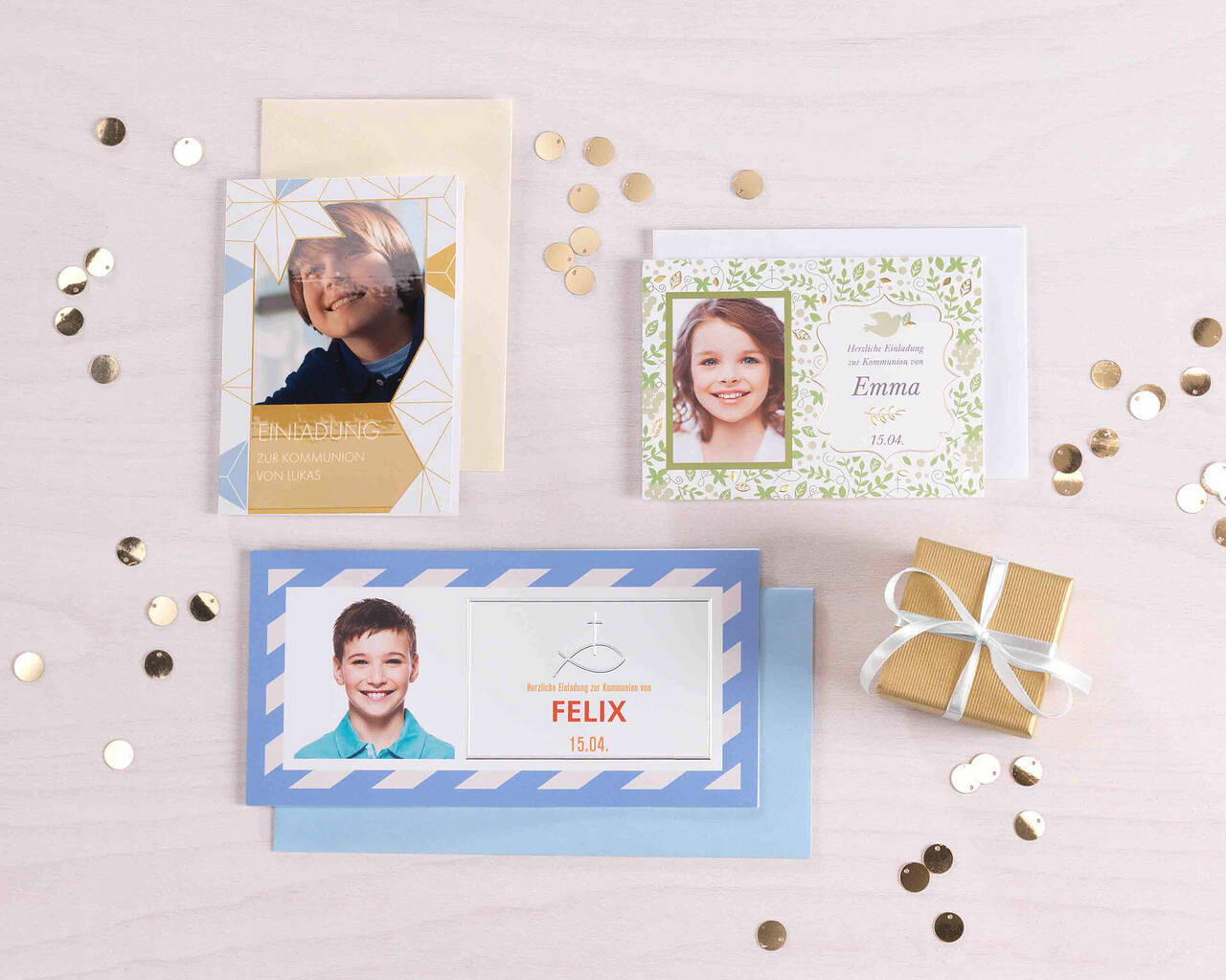Drei liebevoll gestaltete Grußkarten auf einem Tisch mit Konfetti und einem kleinen Geschenk.