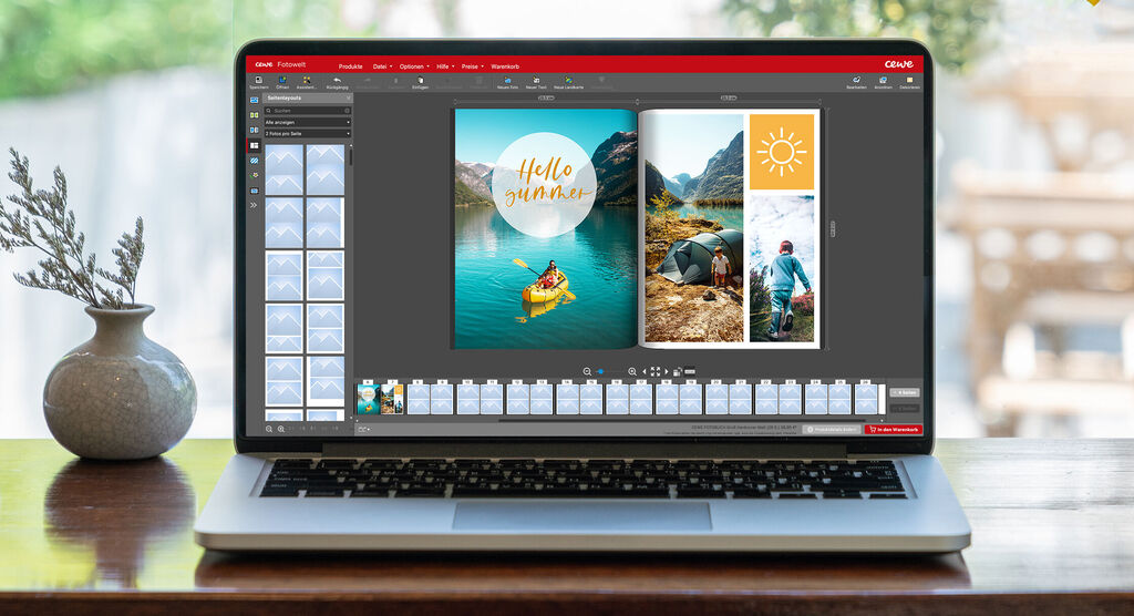 Screenshot von der CEWE Fotowelt Software zum Fotobuch erstellen, die eine grüne Landschaft mit einem Boot und ein Bild von Personen zeigt.