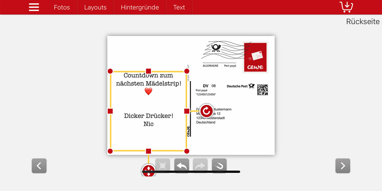 Screenshot der CEWE Fotowelt App, in dem der Postkarten-Editor und die beschriebene Rückseite einer Postkarte zu sehen ist.